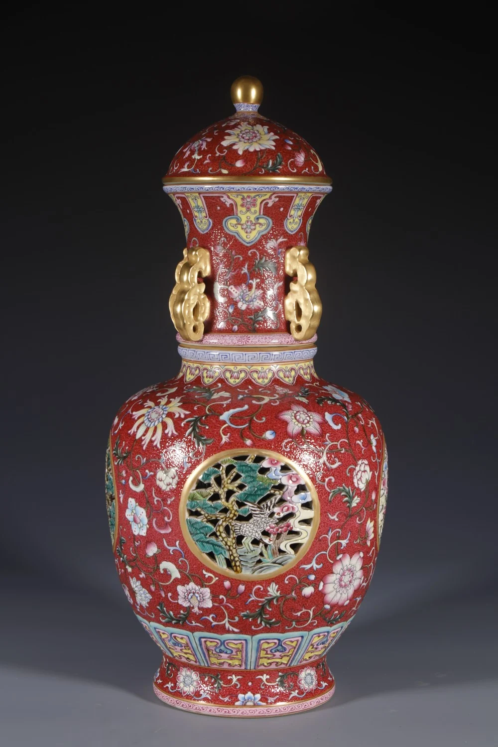 Front view of the red-ground pierced porcelain vase