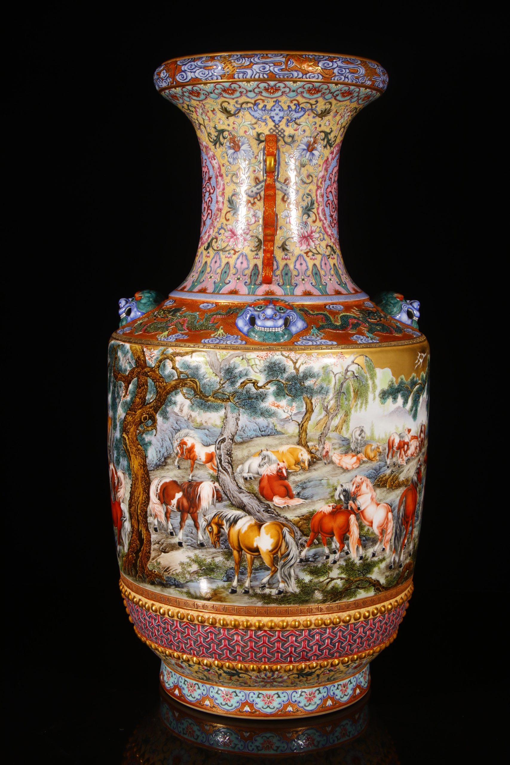 Full view of one vase showing the long neck and decorated body