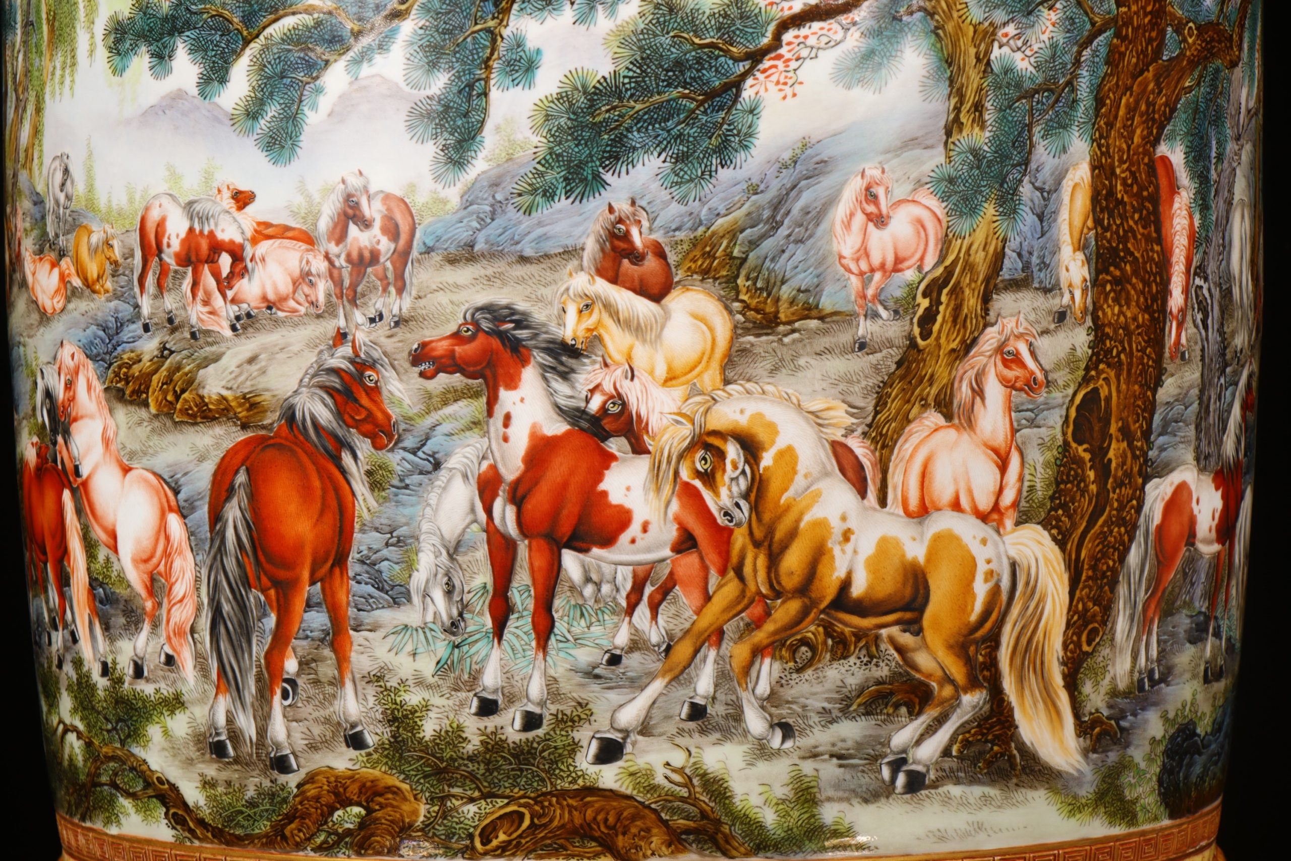 Detail of horses among pine trees and rocks in the painted scene