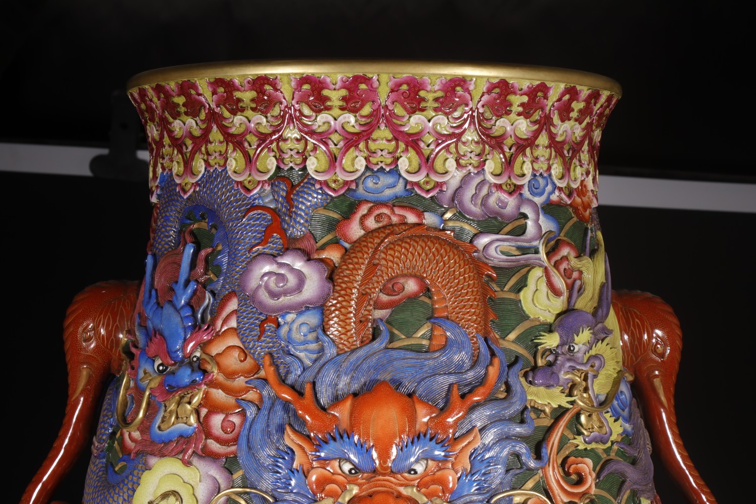 Close view of the nine-dragon relief on the porcelain vase