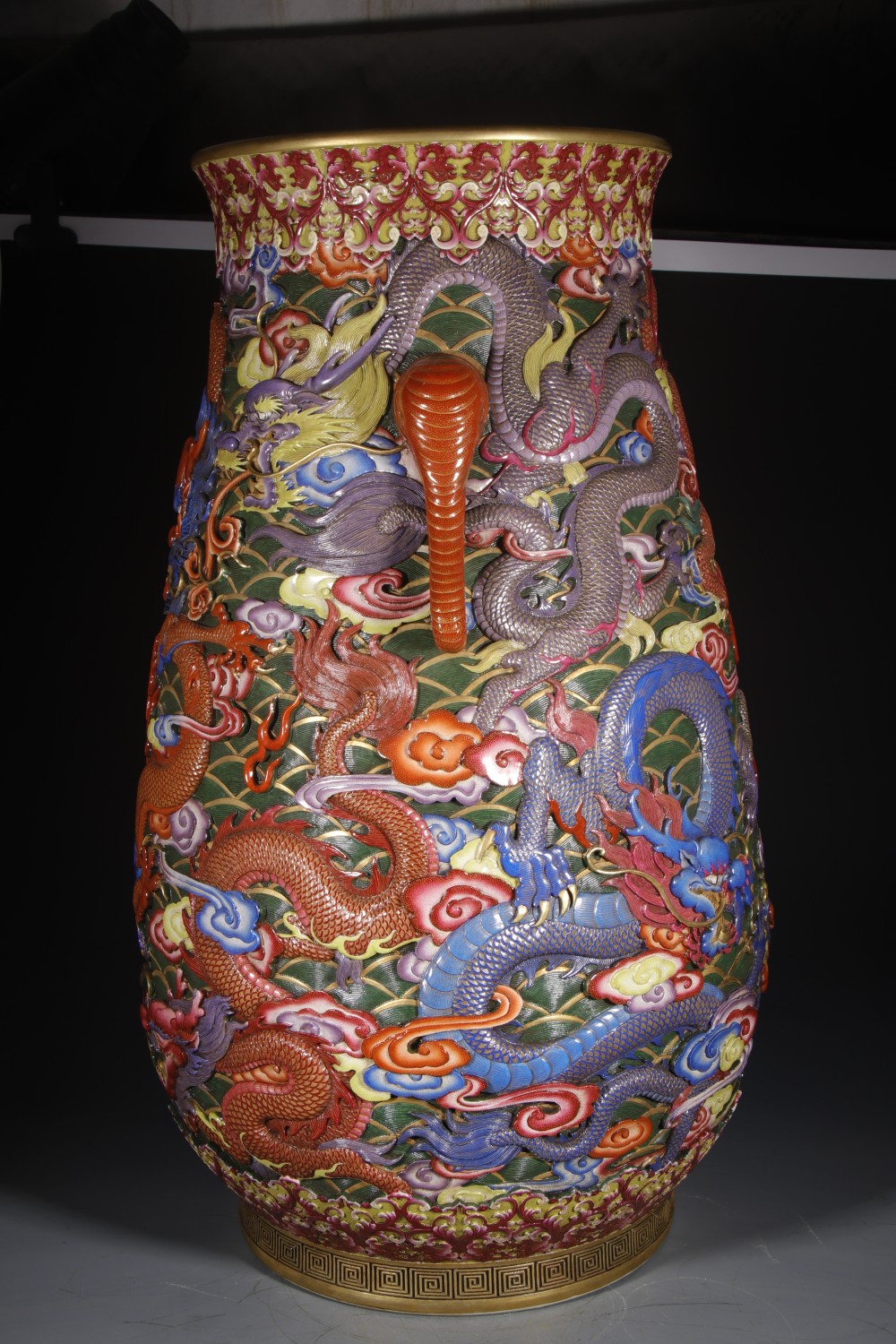 Jingdezhen famille-rose porcelain vase showing dragon and cloud motifs