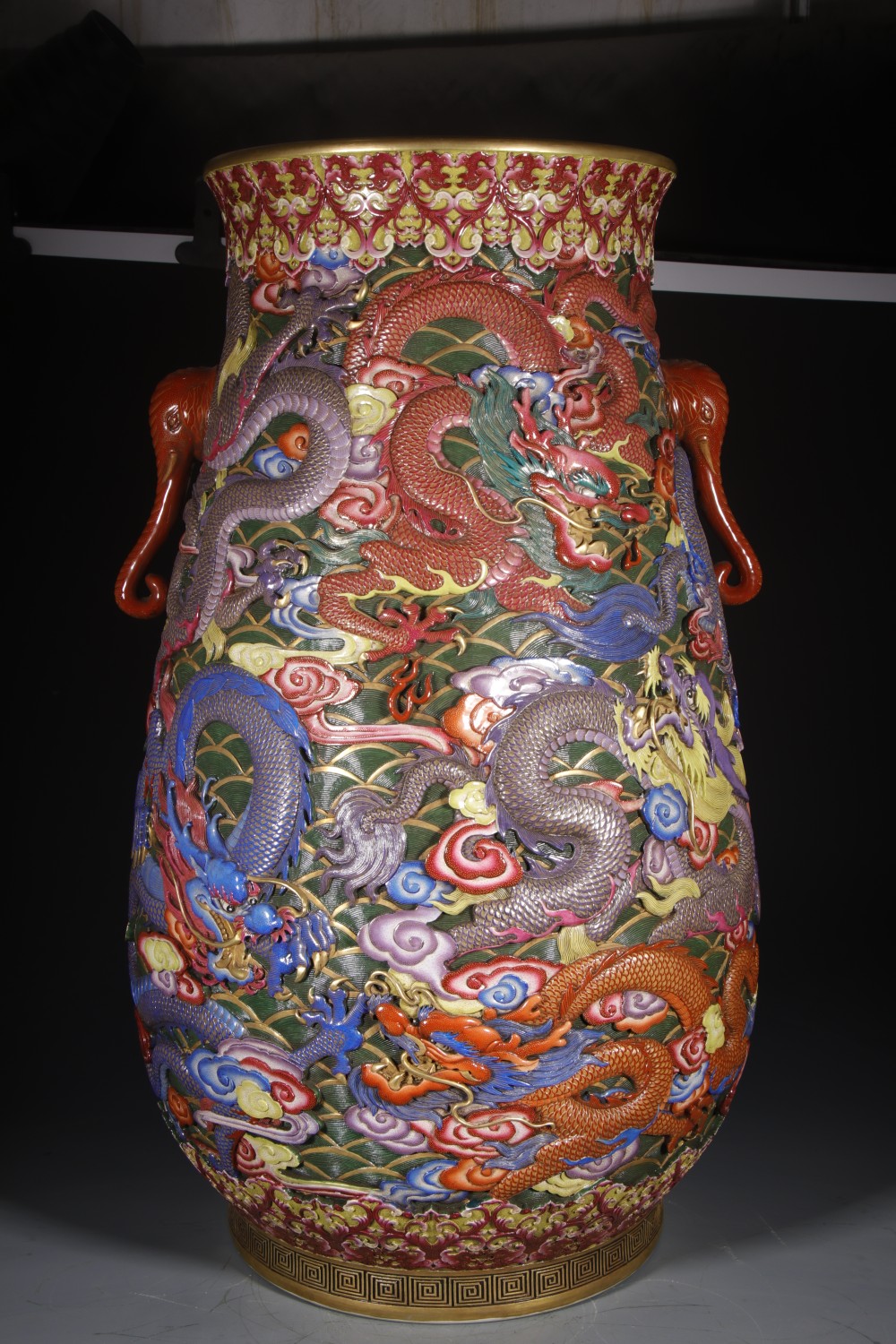 Elephant-trunk handle and gilt detail on a Qianlong-style vase